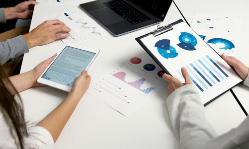 Financial risk assessment charts and graphs on desk